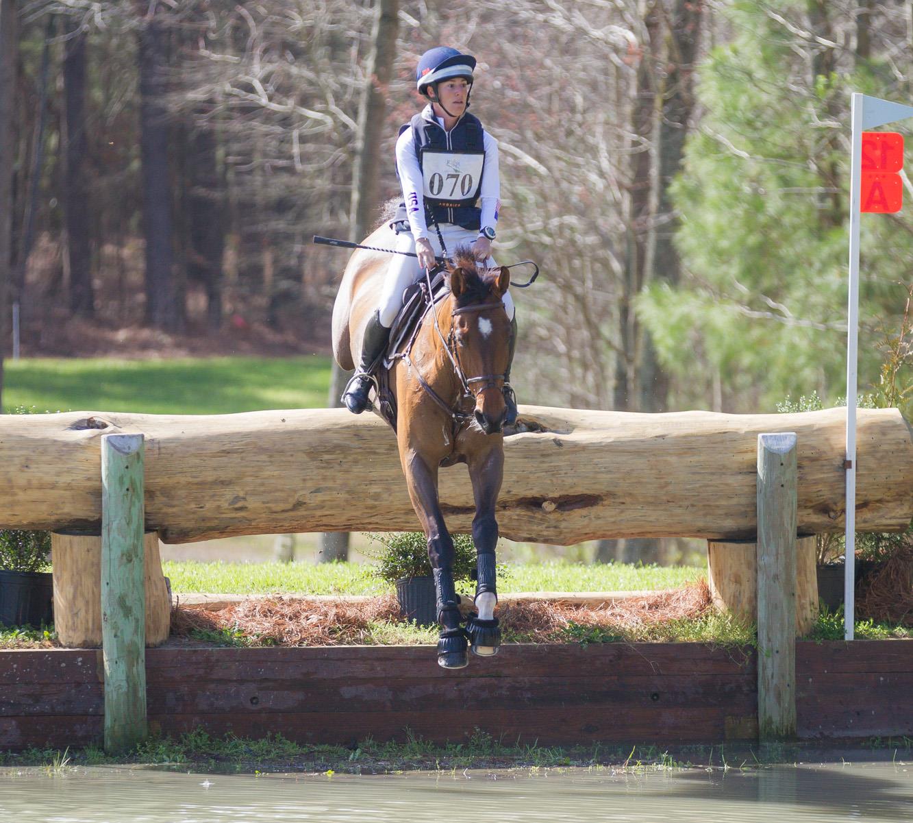 Jenny Caras and Sommersby dropping into the water on the cross-country course