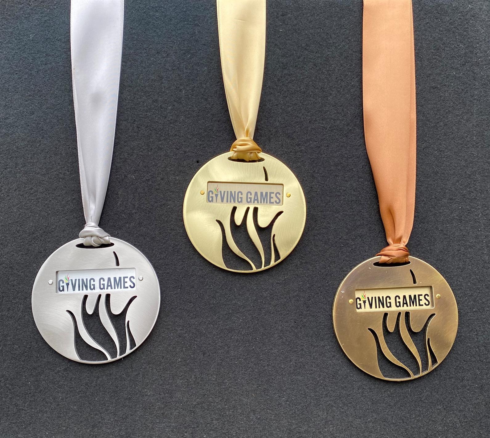 Bronze, silver, and gold Medals of Giving