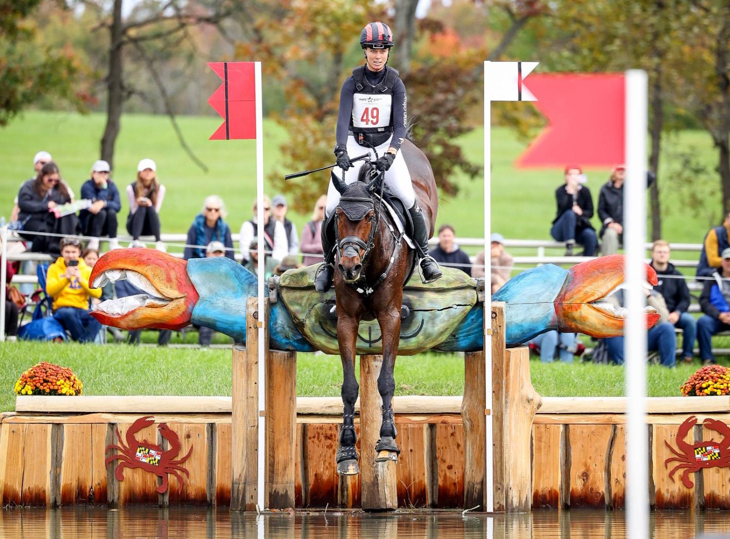 Caroline Pamukcu and HSH Connor jumping the crab jump into the water at the Maryland 5 Star CCI3*-L