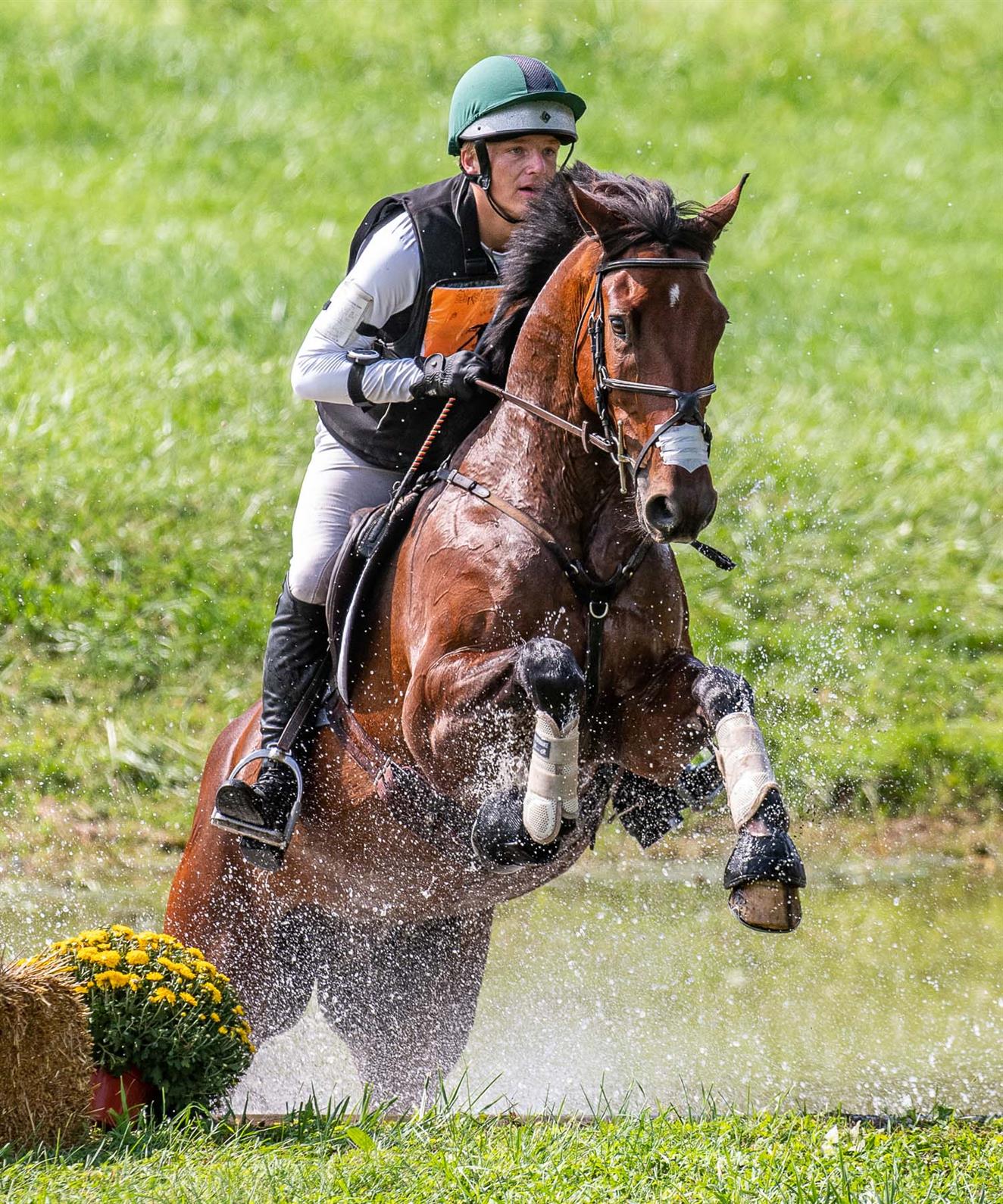 Jack Curtis and Luska Candy Clover jumping out of the water on cross-country at the YTC Unionville
